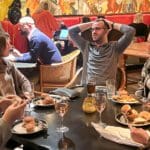 People casually chatting at their table