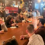 People talking at the long table